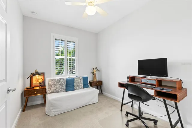 a bedroom with a bed and a tv