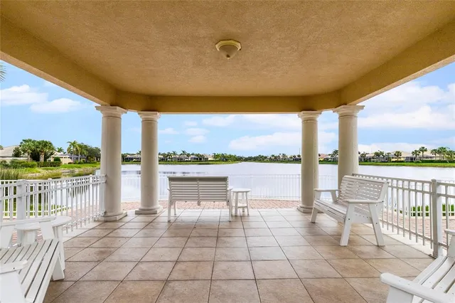 a view of a pathway with a flower garden