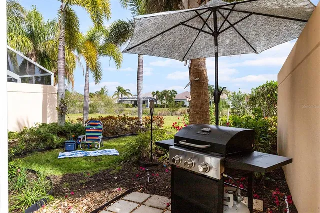 a table and chairs sitting in front of a house