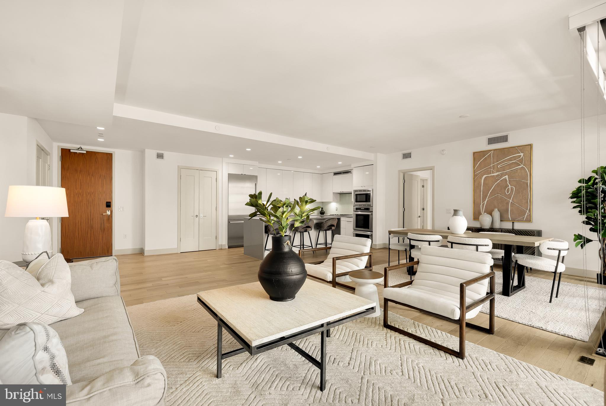 45 Sutton Square Southwest, Unit 906 Washington, DC 20024 - Photo 23 of 50 a living room with furniture a table and a potted plant