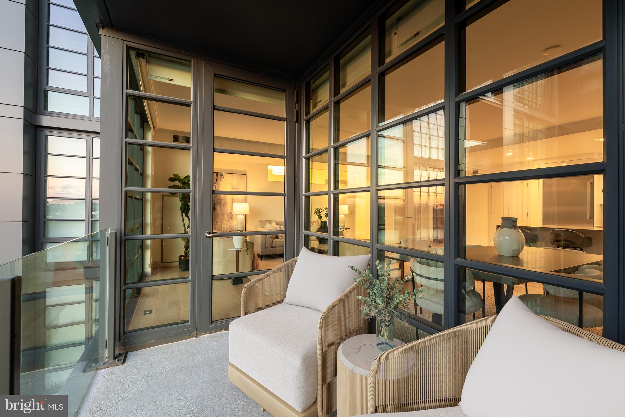 45 Sutton Square Southwest, Unit 906 Washington, DC 20024 - Photo 10 of 50 a living room with furniture and a window