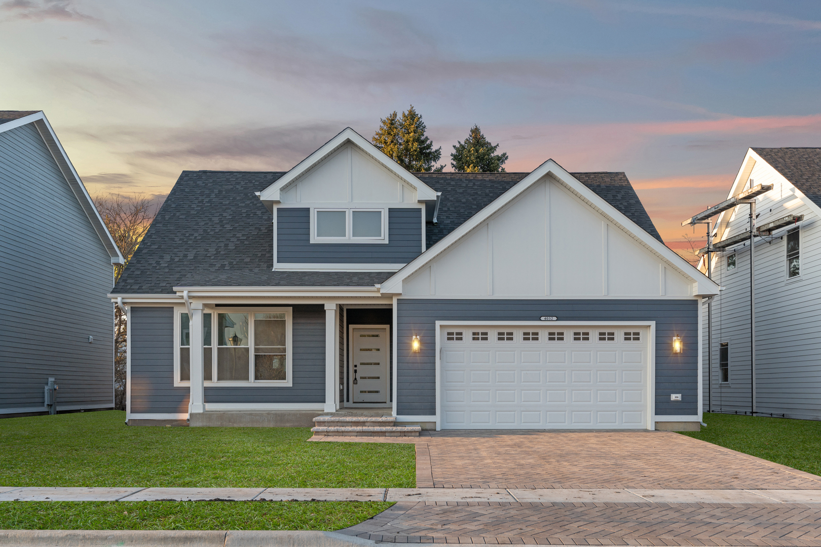 a view of a house with a yard and garage
