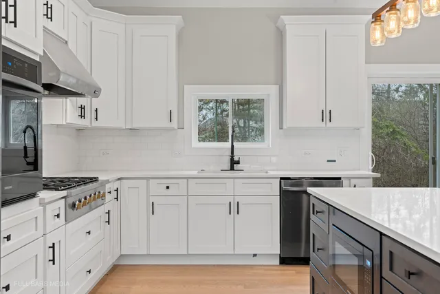 a kitchen with a sink and cabinets