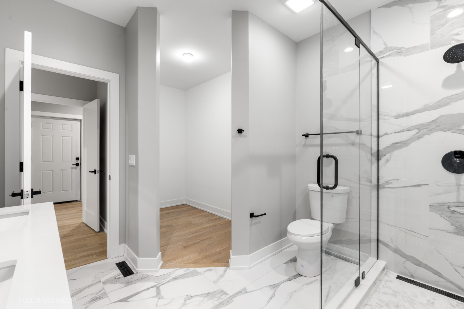 4032 Faith Lane St. Charles, IL 60174 - Photo 18 of 38 a bathroom with a granite countertop shower a mirror and a toilet