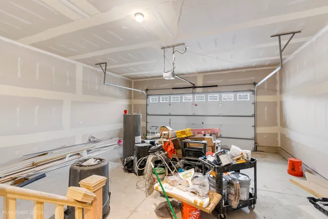 a kitchen with stainless steel appliances a stove microwave and sink