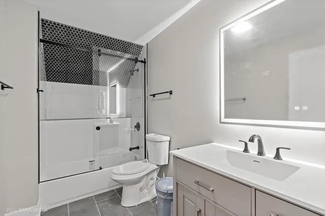 an empty room with a window and a ceiling fan