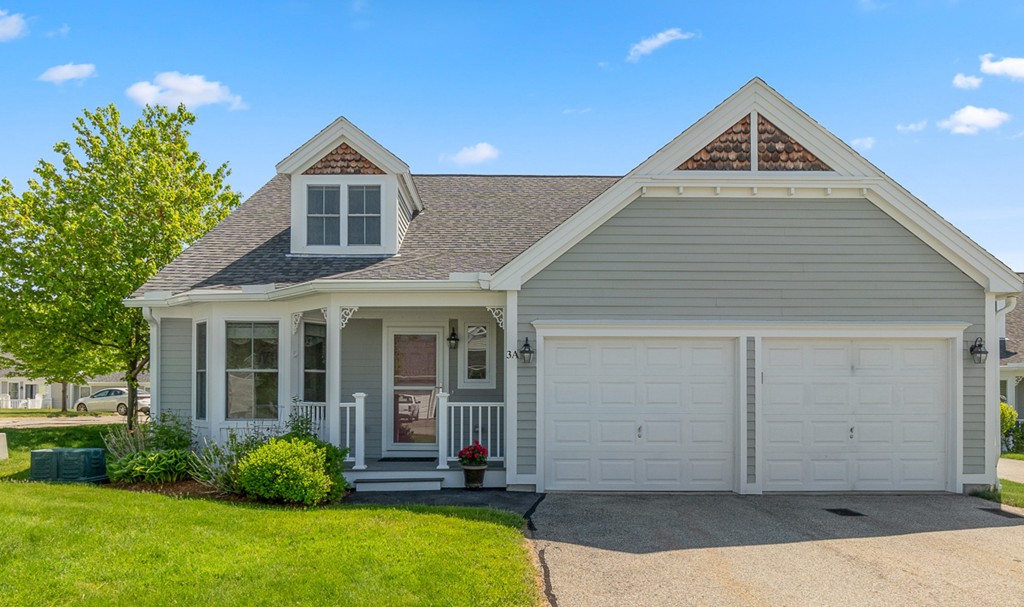 3 Strawberry Lane, Unit A Hudson, MA 01749 - Photo 1 of 29 a front view of a house with a yard