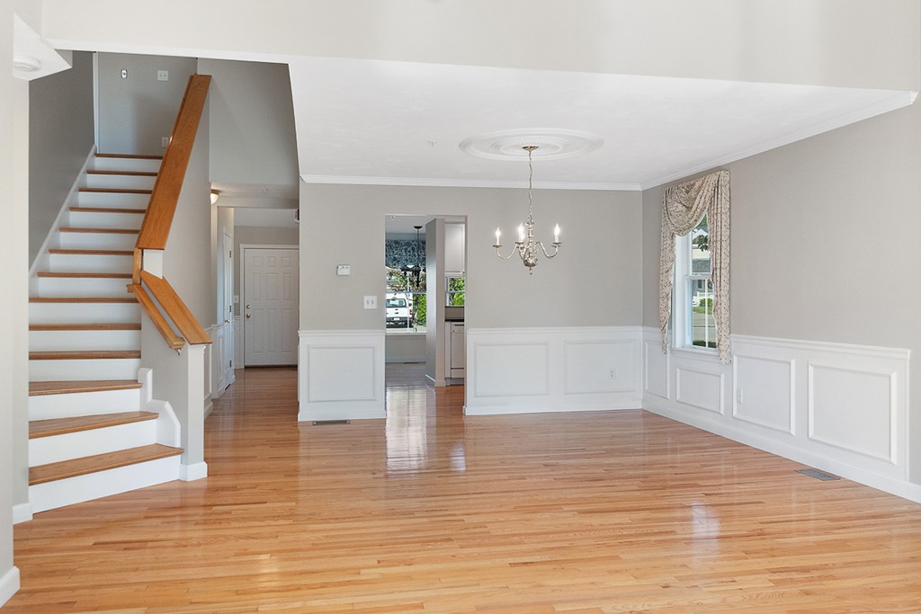 3 Strawberry Lane, Unit A Hudson, MA 01749 - Photo 13 of 29 a view of an entryway with wooden floor and stairs