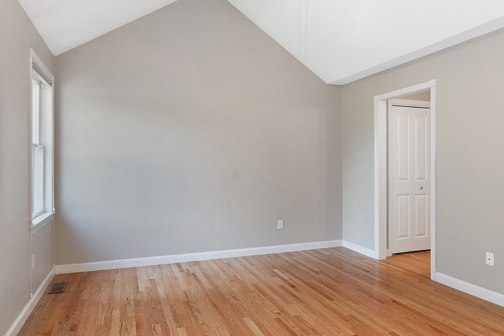 3 Strawberry Lane, Unit A Hudson, MA 01749 - Photo 14 of 29 a view of an empty room with wooden floor