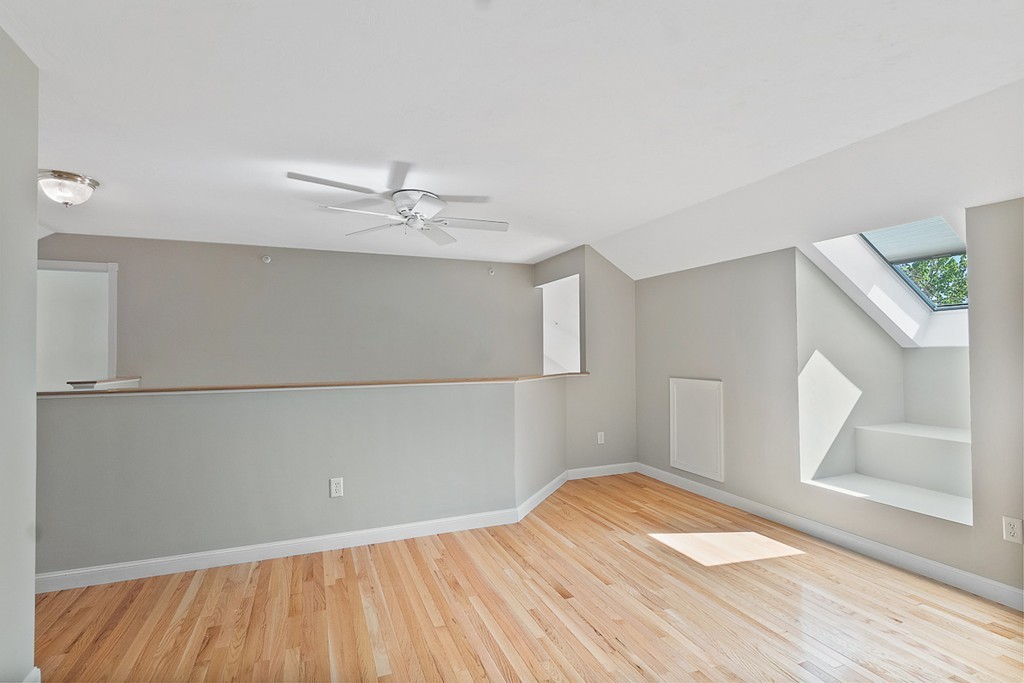 3 Strawberry Lane, Unit A Hudson, MA 01749 - Photo 22 of 29 wooden floor in an empty room with a window