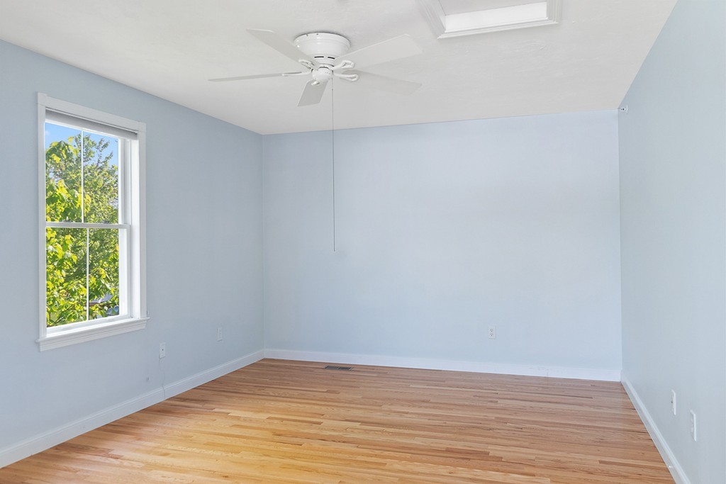 3 Strawberry Lane, Unit A Hudson, MA 01749 - Photo 24 of 29 wooden floor in an empty room with a window