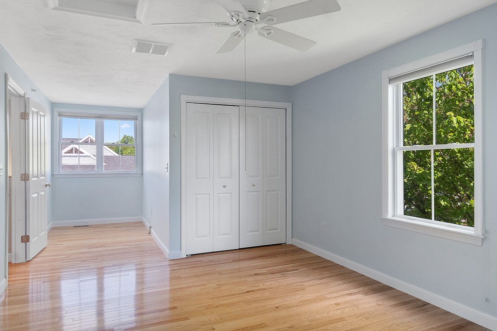 3 Strawberry Lane, Unit A Hudson, MA 01749 - Photo 25 of 29 wooden floor in an empty room with a window