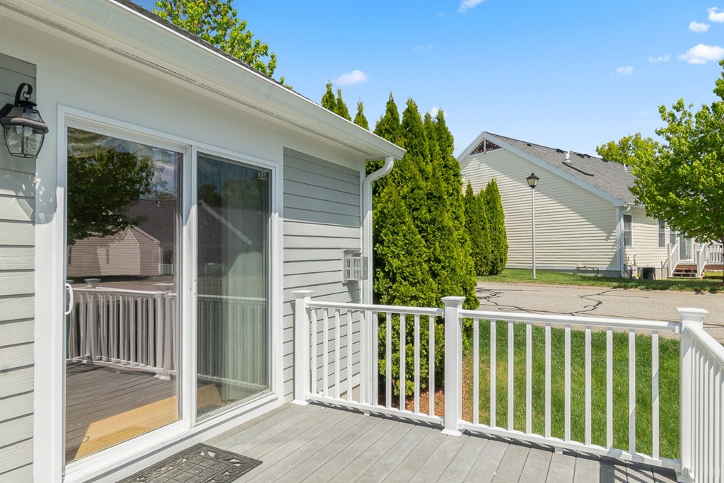 3 Strawberry Lane, Unit A Hudson, MA 01749 - Photo 27 of 29 a view of a house with a porch