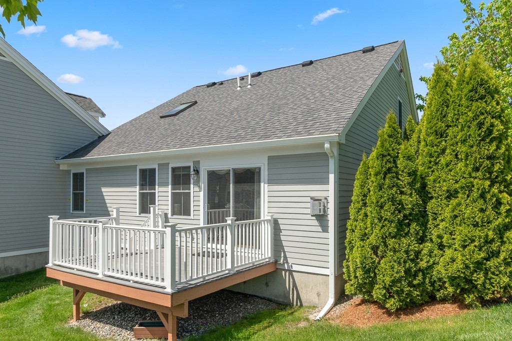 3 Strawberry Lane, Unit A Hudson, MA 01749 - Photo 28 of 29 a view of backyard with deck and deck