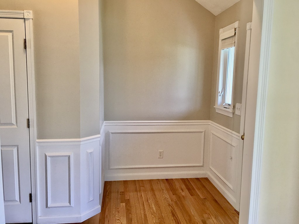 3 Strawberry Lane, Unit A Hudson, MA 01749 - Photo 5 of 29 a view of an empty walk in closet with wooden floor