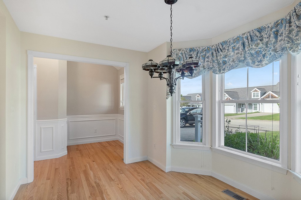 3 Strawberry Lane, Unit A Hudson, MA 01749 - Photo 6 of 29 a view of a room with a window and wooden floor
