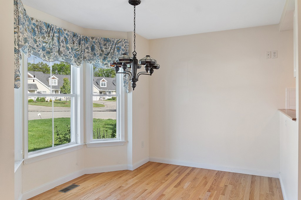 3 Strawberry Lane, Unit A Hudson, MA 01749 - Photo 7 of 29 a view of a room with a window and wooden floor