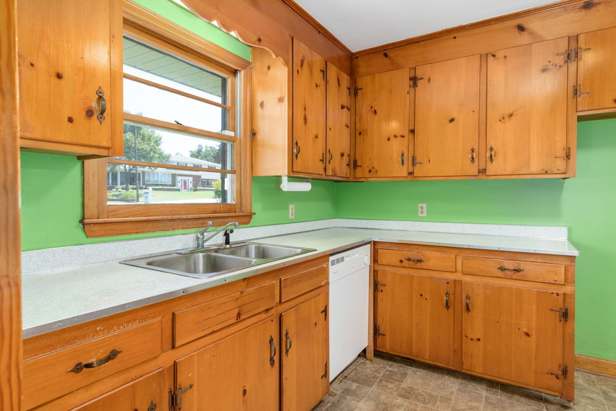 1309 Alpha Road Henderson, NC 27536 - Photo 15 of 26 a kitchen with sink and cabinets