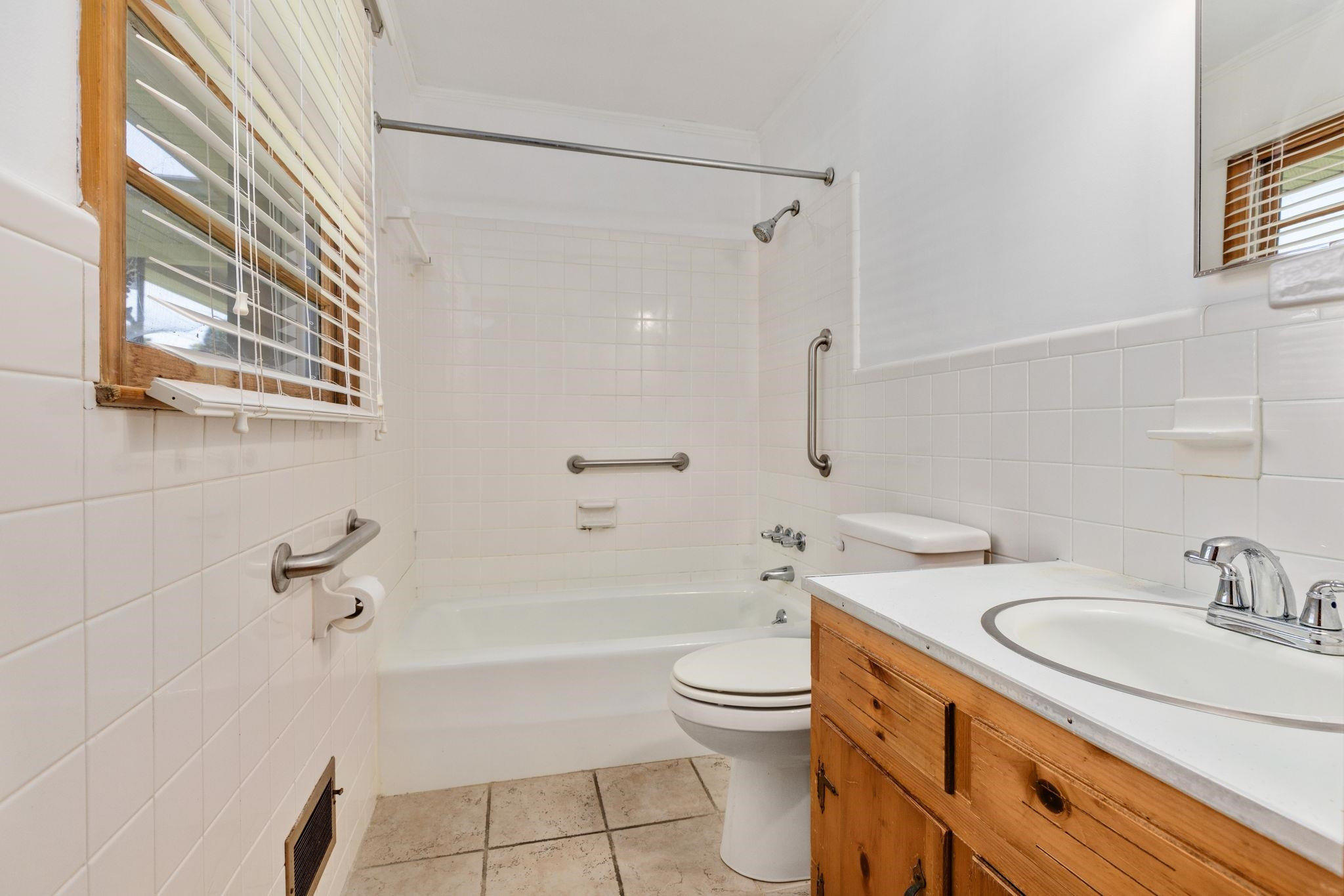 1309 Alpha Road Henderson, NC 27536 - Photo 20 of 26 a bathroom with a sink a toilet and bathtub