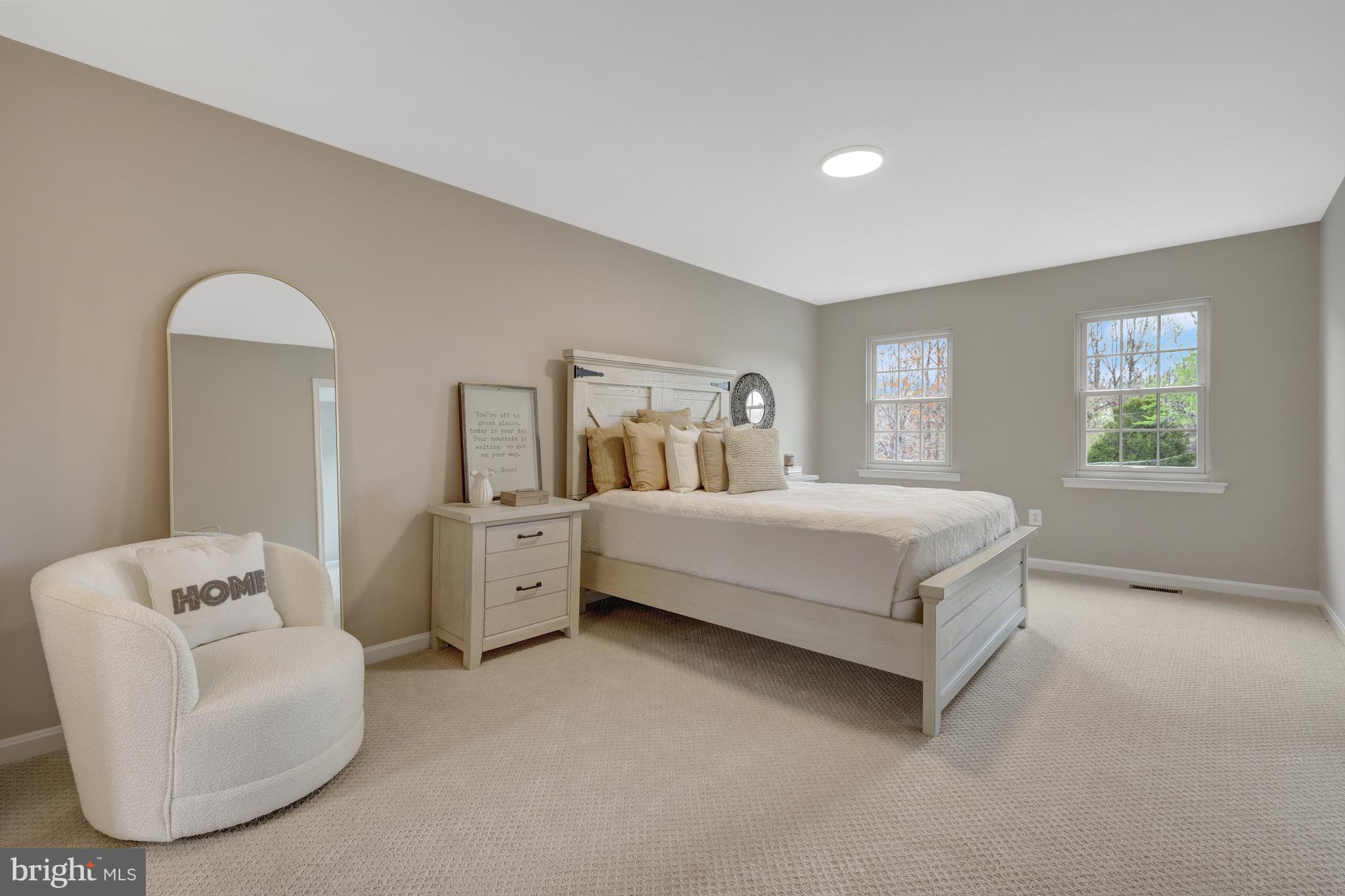 1215 Bishopsgate Way Reston, VA 20194 - Photo 15 of 41 a spacious bedroom with a bed and a couch
