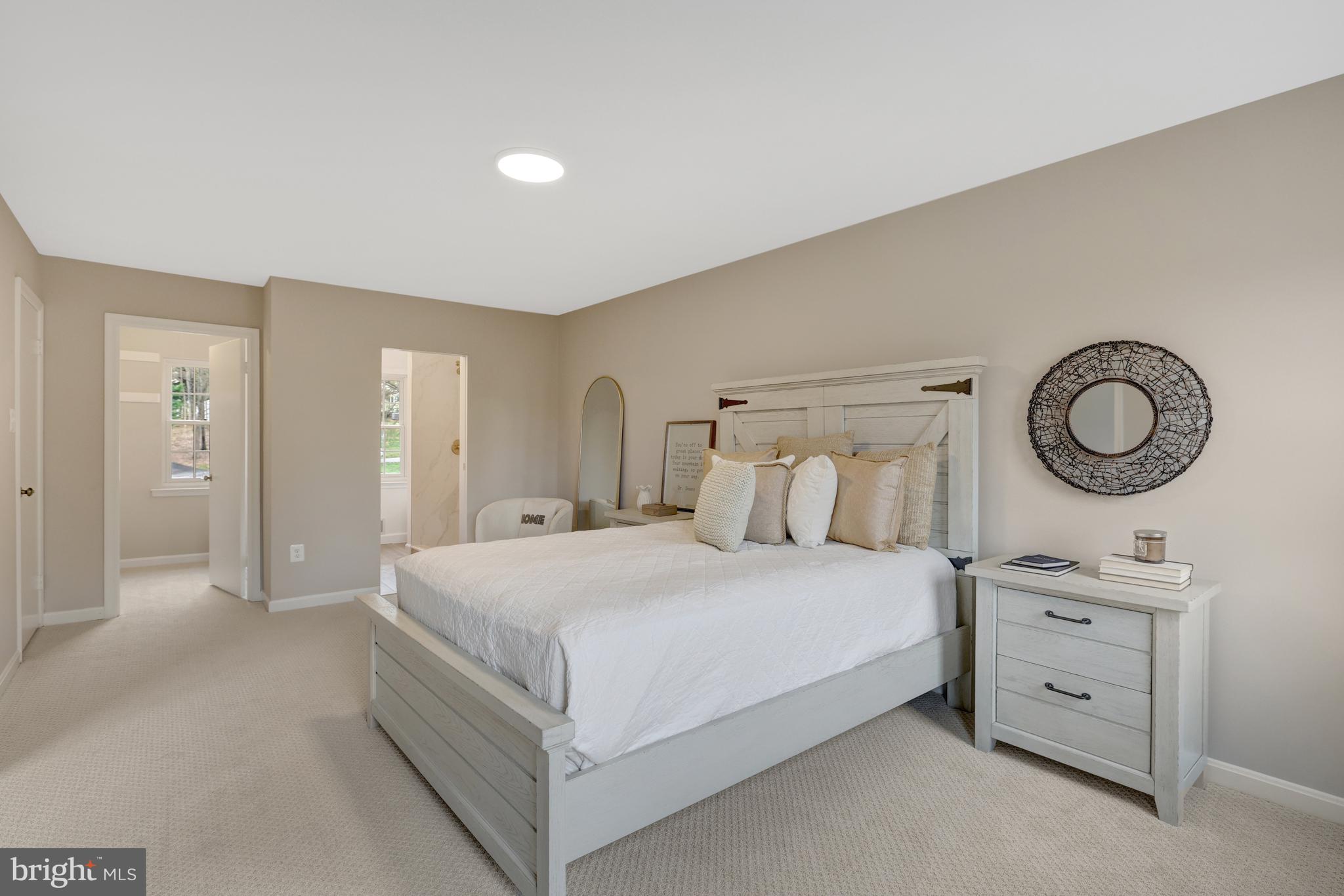 1215 Bishopsgate Way Reston, VA 20194 - Photo 16 of 41 a bedroom with a bed and cabinets