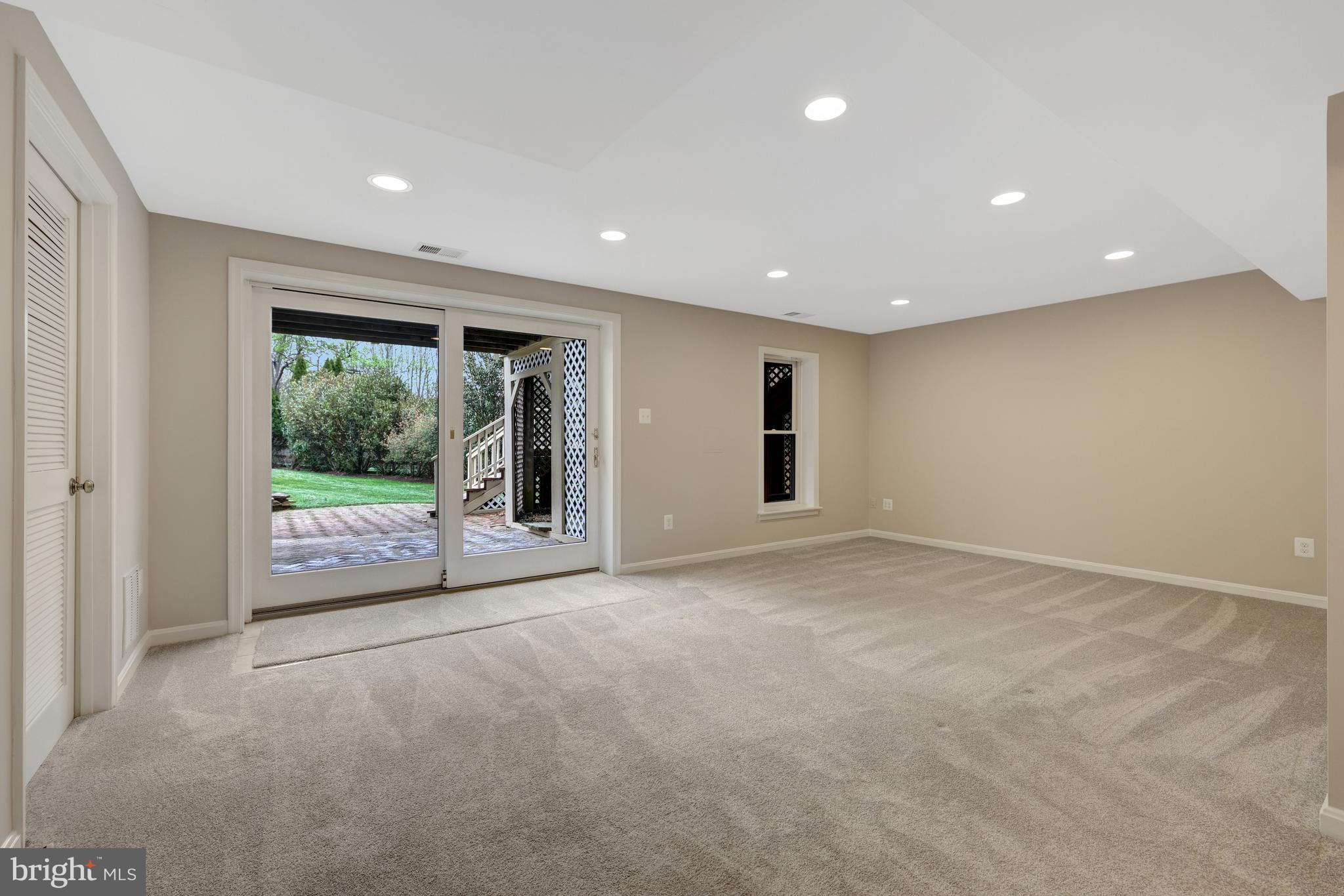 1215 Bishopsgate Way Reston, VA 20194 - Photo 26 of 41 a view of an empty room with wooden floor and a window