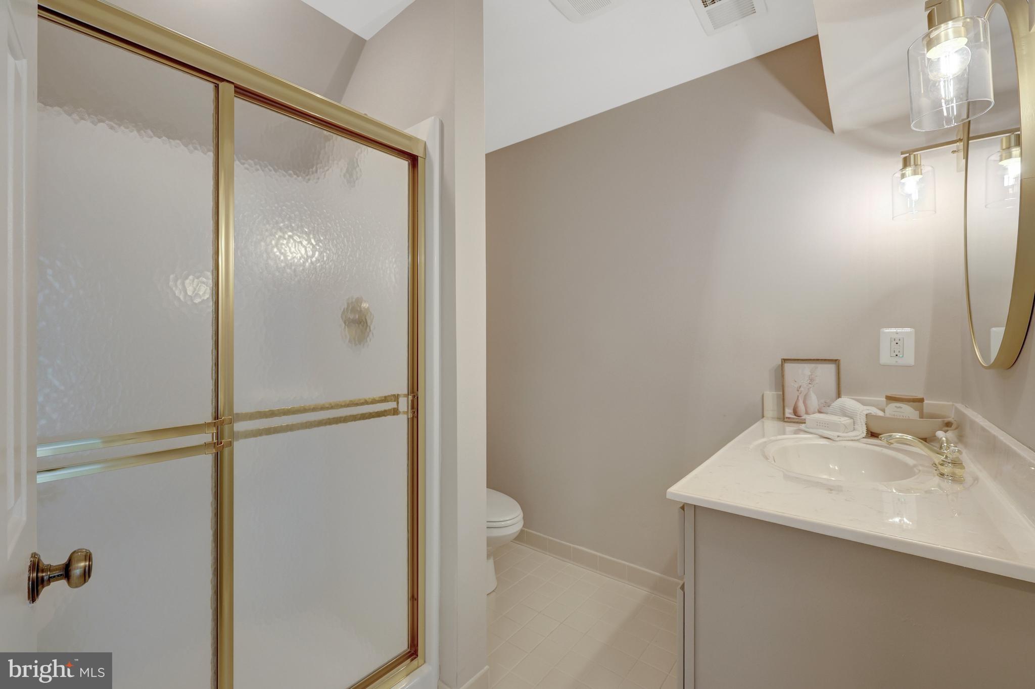 1215 Bishopsgate Way Reston, VA 20194 - Photo 29 of 41 a bathroom with a sink and mirror