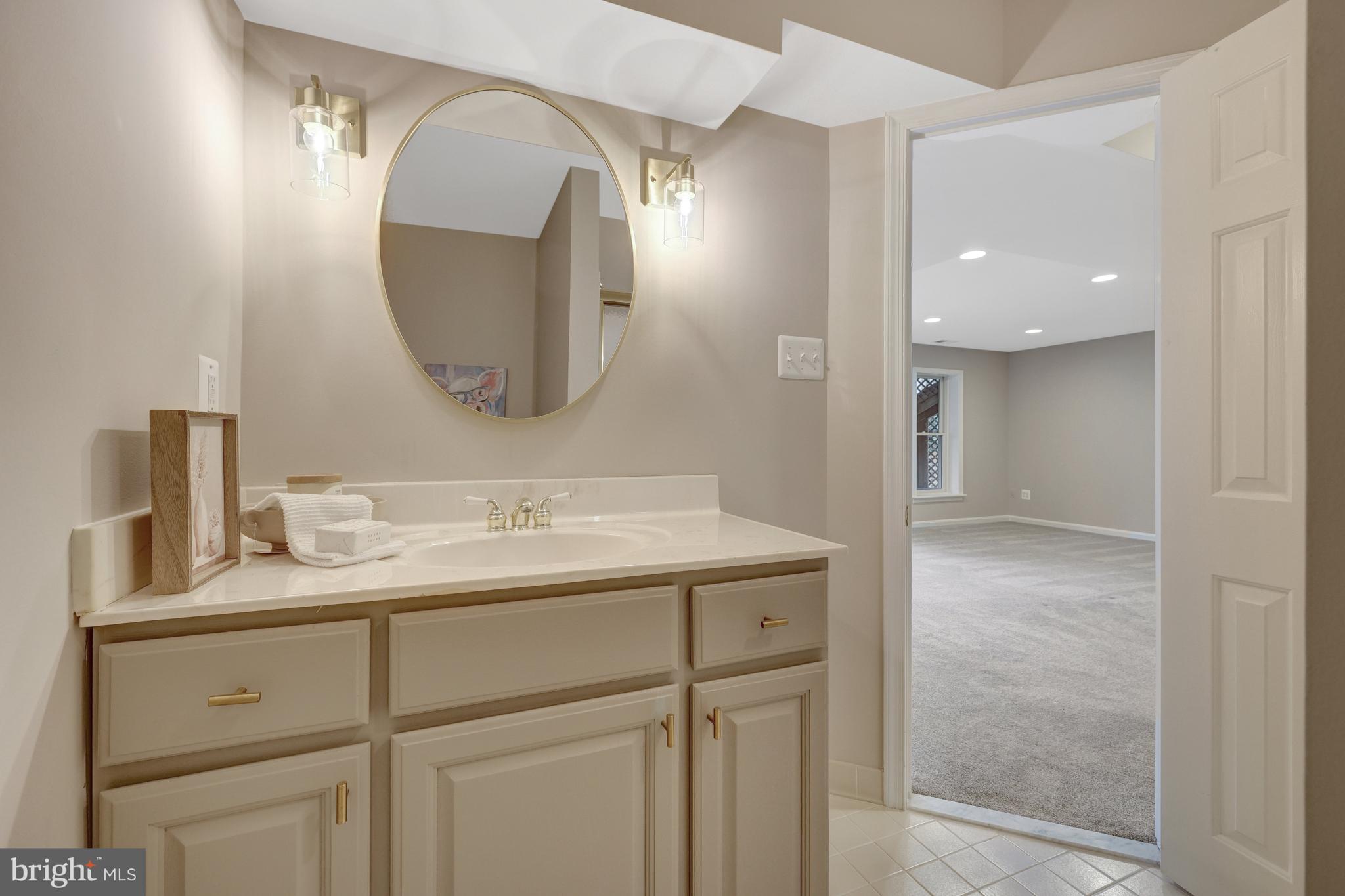 1215 Bishopsgate Way Reston, VA 20194 - Photo 30 of 41 a bathroom with a sink vanity and mirror