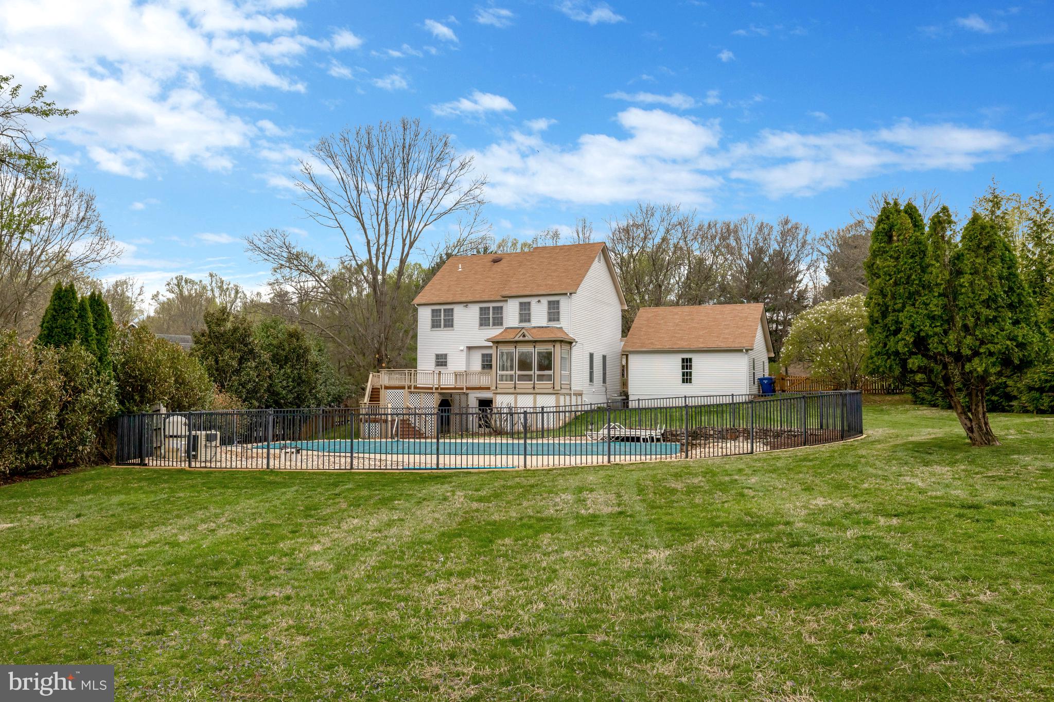 1215 Bishopsgate Way Reston, VA 20194 - Photo 40 of 41 a view of a house with a big yard and large trees