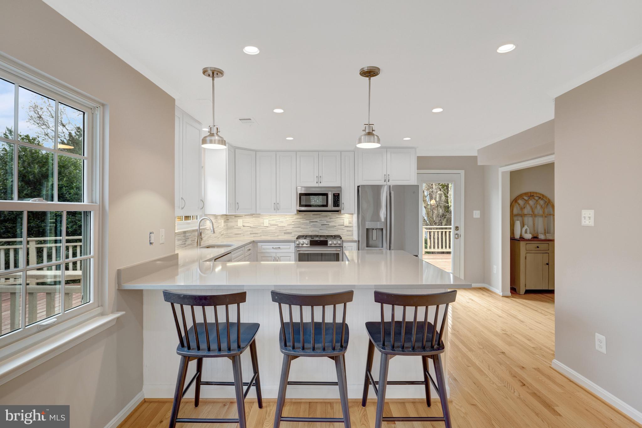 1215 Bishopsgate Way Reston, VA 20194 - Photo 5 of 41 a view of a dining room with furniture window and wooden floor