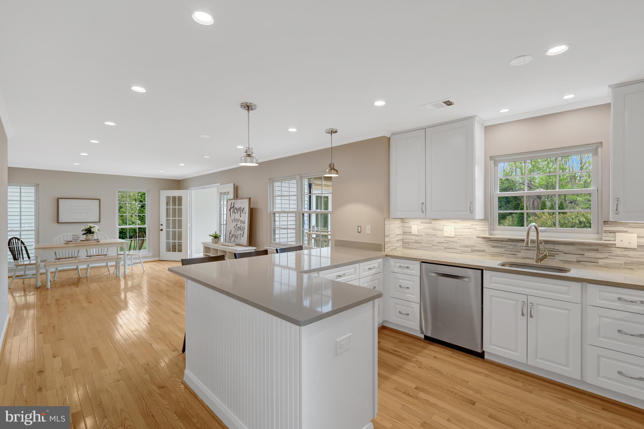 1215 Bishopsgate Way Reston, VA 20194 - Photo 7 of 41 a large kitchen with granite countertop a large counter top and sink
