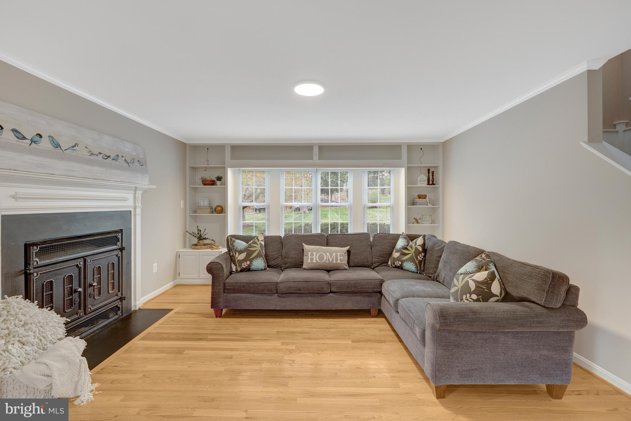 1215 Bishopsgate Way Reston, VA 20194 - Photo 9 of 41 a living room with furniture and a fireplace