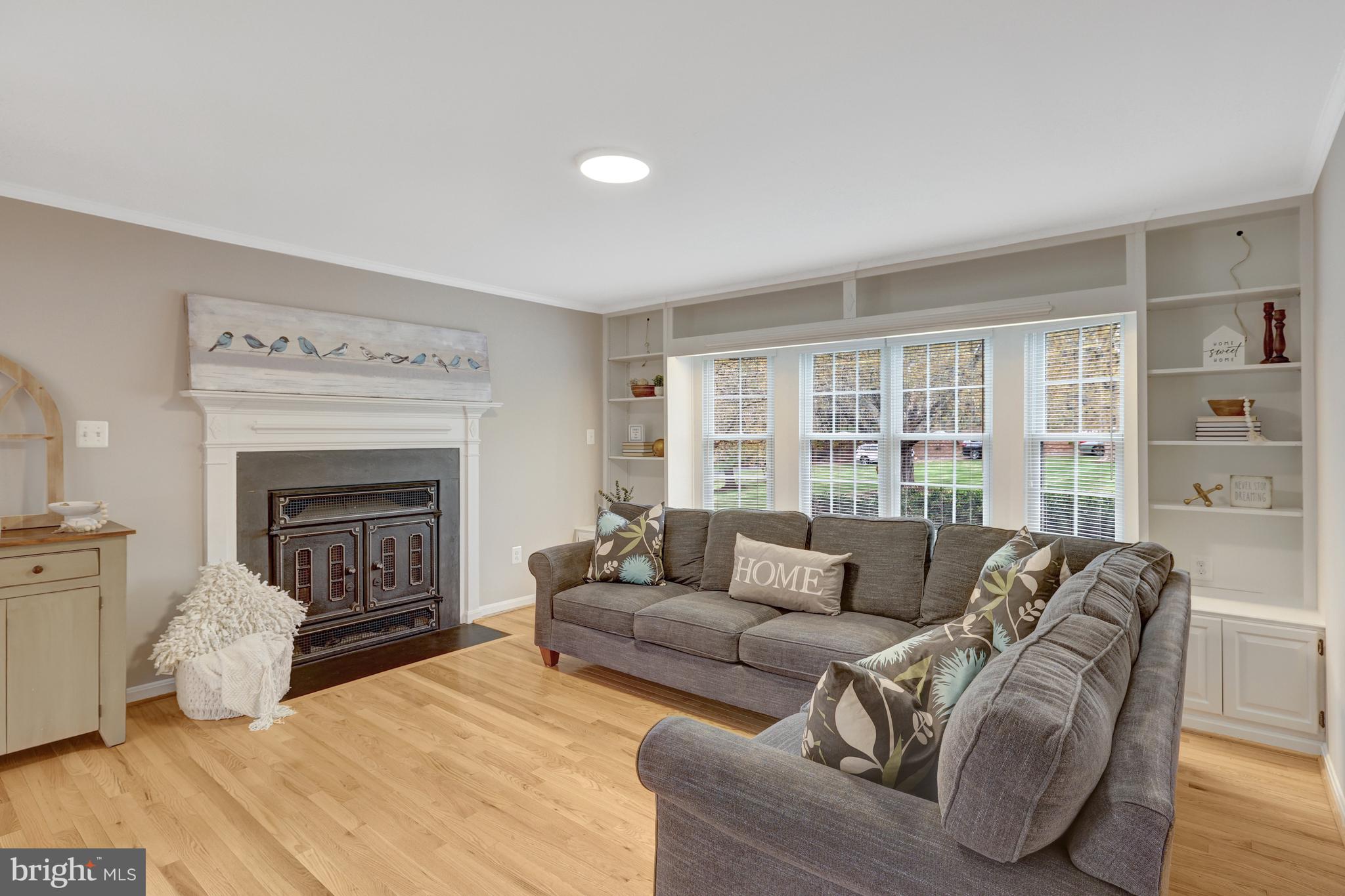 1215 Bishopsgate Way Reston, VA 20194 - Photo 10 of 41 a living room with furniture and a fireplace