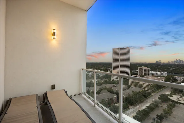 a view of a patio with couches chairs and a yard