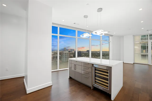 a kitchen that has a sink a stove and refrigerator