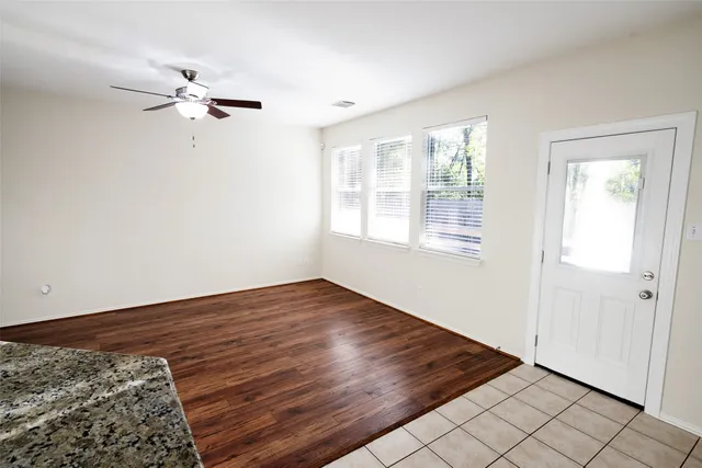 a white bath tub sitting in a bathroom next to a window