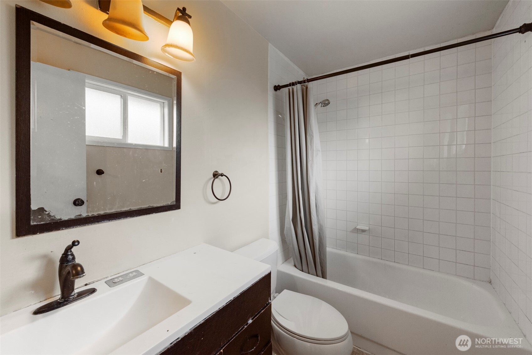 12727 Southeast 191st Place Renton, WA 98058 - Photo 13 of 23 a bathroom with a sink mirror toilet and bathtub