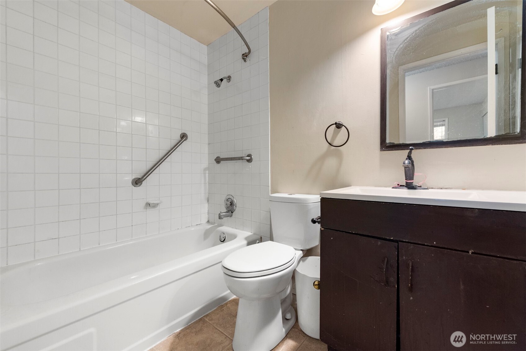 12727 Southeast 191st Place Renton, WA 98058 - Photo 15 of 23 a bathroom with a bathtub shower sink vanity and toilet