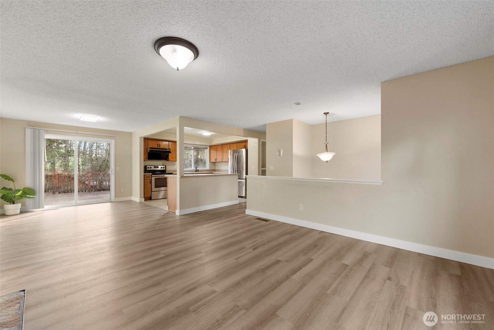 12727 Southeast 191st Place Renton, WA 98058 - Photo 5 of 23 a view of kitchen with furniture and wooden floor