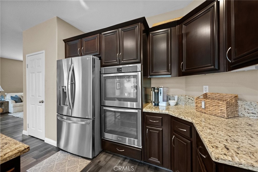 7220 Cumberland Place Rancho Cucamonga, CA 91739 - Photo 15 of 41 Well-equipped kitchen featuring a stainless refrigerator and built-in double ovens.