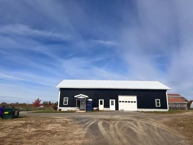 a bedroom with bed and a chandelier