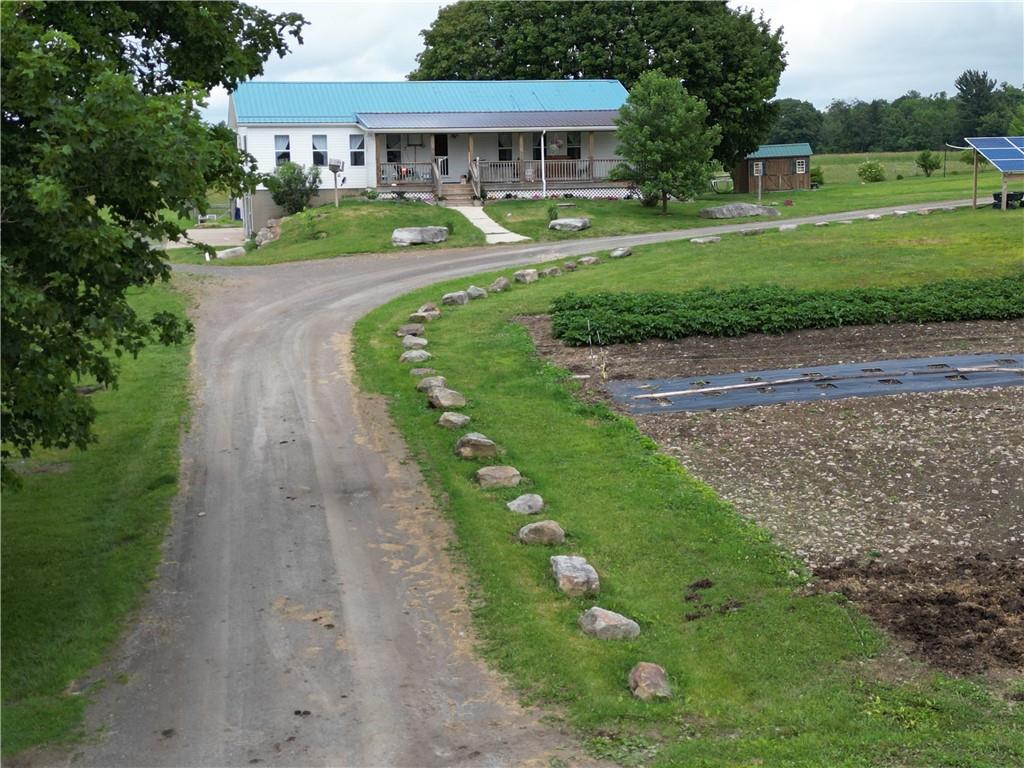 13170 Highway 36 Punxsutawney, PA 15767 - Photo 26 of 37 a view of a swimming pool with a garden and plants