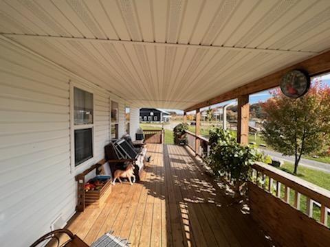13170 Highway 36 Punxsutawney, PA 15767 - Photo 27 of 37 a view of a patio with table and chairs with wooden floor and fence