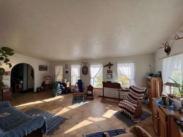 a bedroom with a bed and large mirror