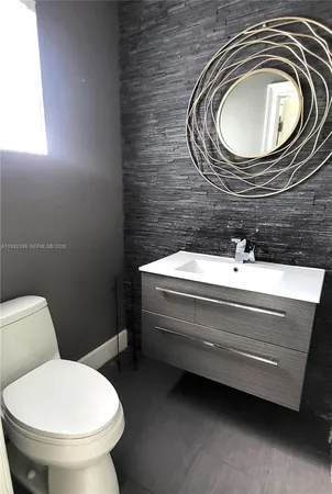 a bathroom with a toilet and a sink