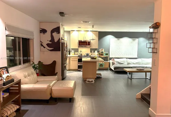 a view of a workspace with furniture and a couch