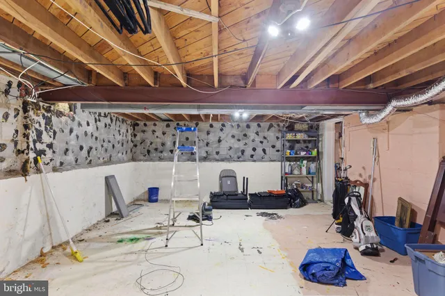 a room with gym equipment and a mirror