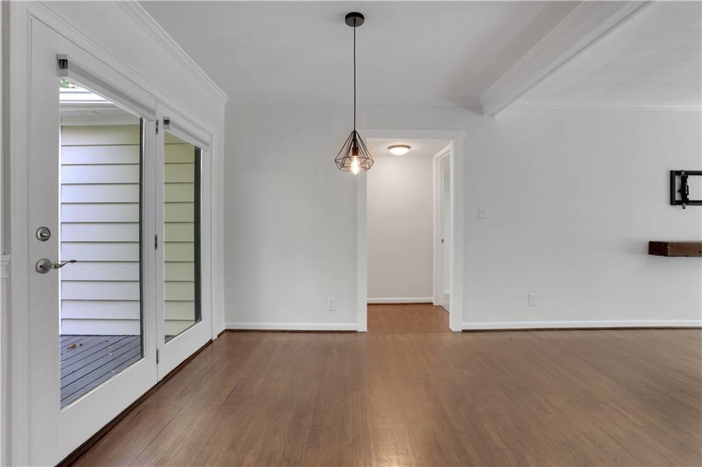 3038 Flamingo Drive Decatur, GA 30033 - Photo 8 of 39 a view of a room with wooden floor and white walls