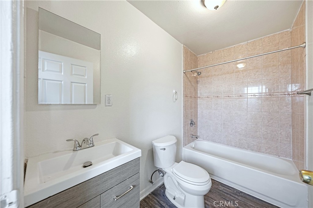 10929 Compton Avenue Los Angeles, CA 90059 - Photo 11 of 29 a bathroom with a sink a toilet and a bathtub