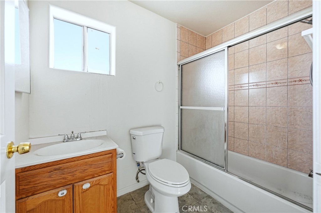 10929 Compton Avenue Los Angeles, CA 90059 - Photo 16 of 29 a bathroom with a sink a toilet and shower